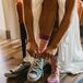 Bride Wearing Blue Converse Underneath Her Wedding Dress