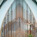 "Our wedding took place in the new and improved contemporary-style Our Lady Queen of Angels Catholic Church at 3pm. The church architecture was so beautiful and dramatic that it didn’t require much!" says Anne.  "I asked two close friends to greet people at the door and pass out programs, displayed on a vintage silver platter, as guests arrived; meanwhile, Garrett had three friends serve as escorts."