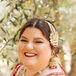 A Bride in a Red Wedding Lehenga and Gold Jewelry Smiles Before Her Ceremony
