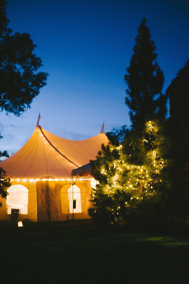 White Reception Tent Lit Up with String Lighting