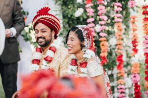 Couple Under Mandap at Colorful Interfaith Ceremony
