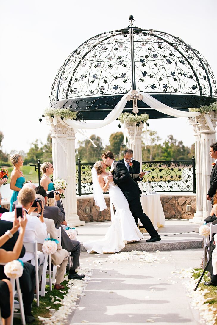 The couple exchanged vows outdoors, under a gorgeous column gazebo on Old Ranch Country Club's grounds.