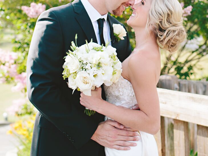 Karlie carried an all-white bouquet of roses and lisianthus, designed and arranged by Couture Flowers.