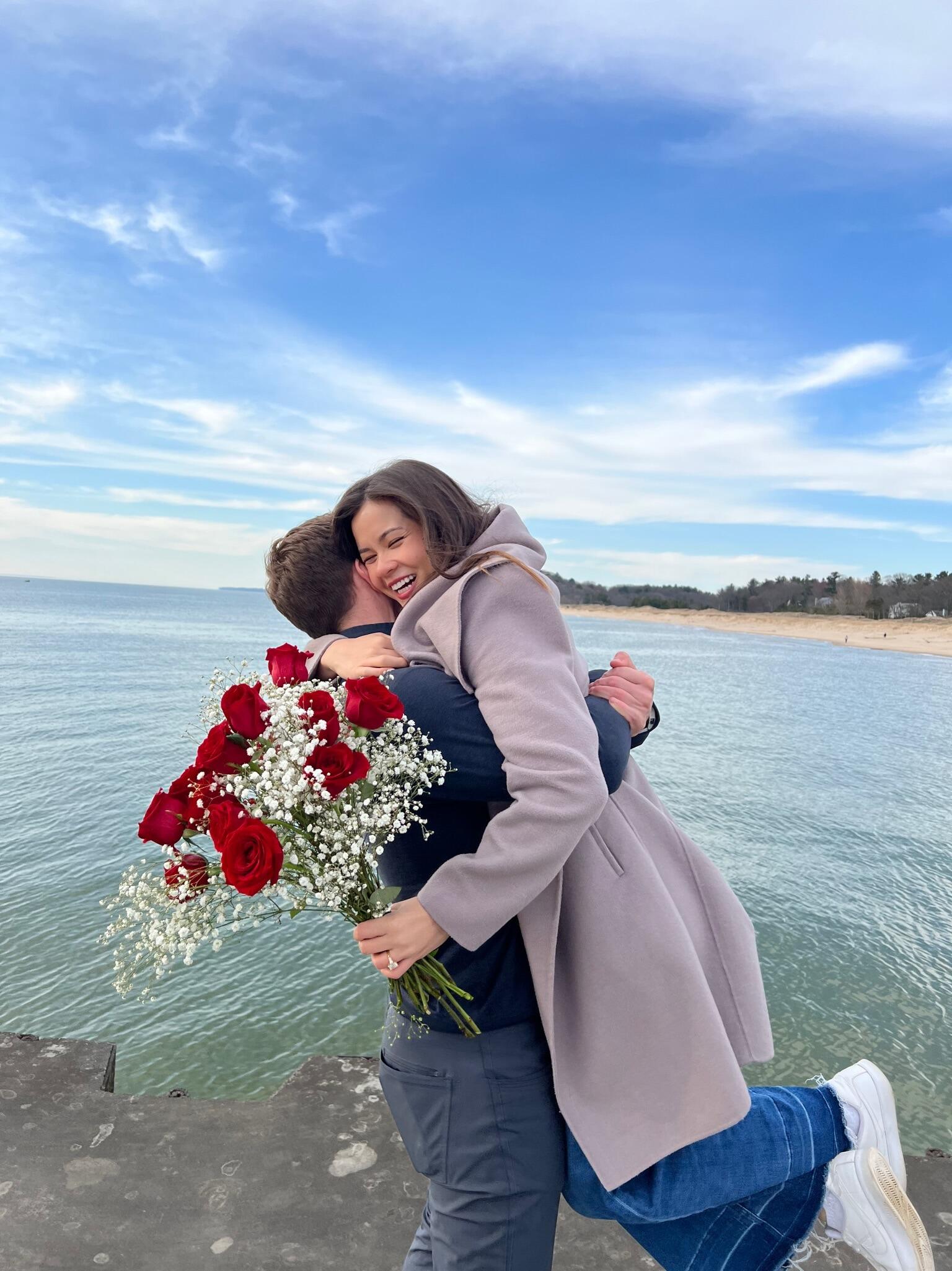 Engaged! Matt (finally) proposes to Madeline on the pier in Montague, Michigan. 
