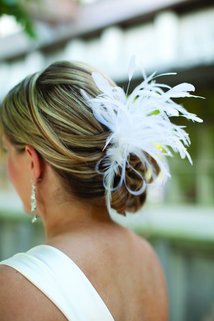 After the ceremony, Amy removed her veil and kept her feather hairpiece tucked into her low updo.
