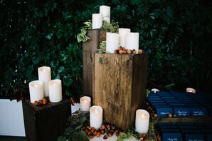 White Candles on Tree Stumps with Acorns
