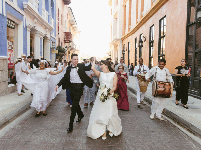 Bride and groom dancing in the streets of Colombia.