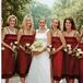 In chic contrast to Susan's airy look, the six bridesmaids wore deep ruby organza knee-length dresses with satin trim by Thread Design and carried light and dark rose bouquets with hydrangeas.